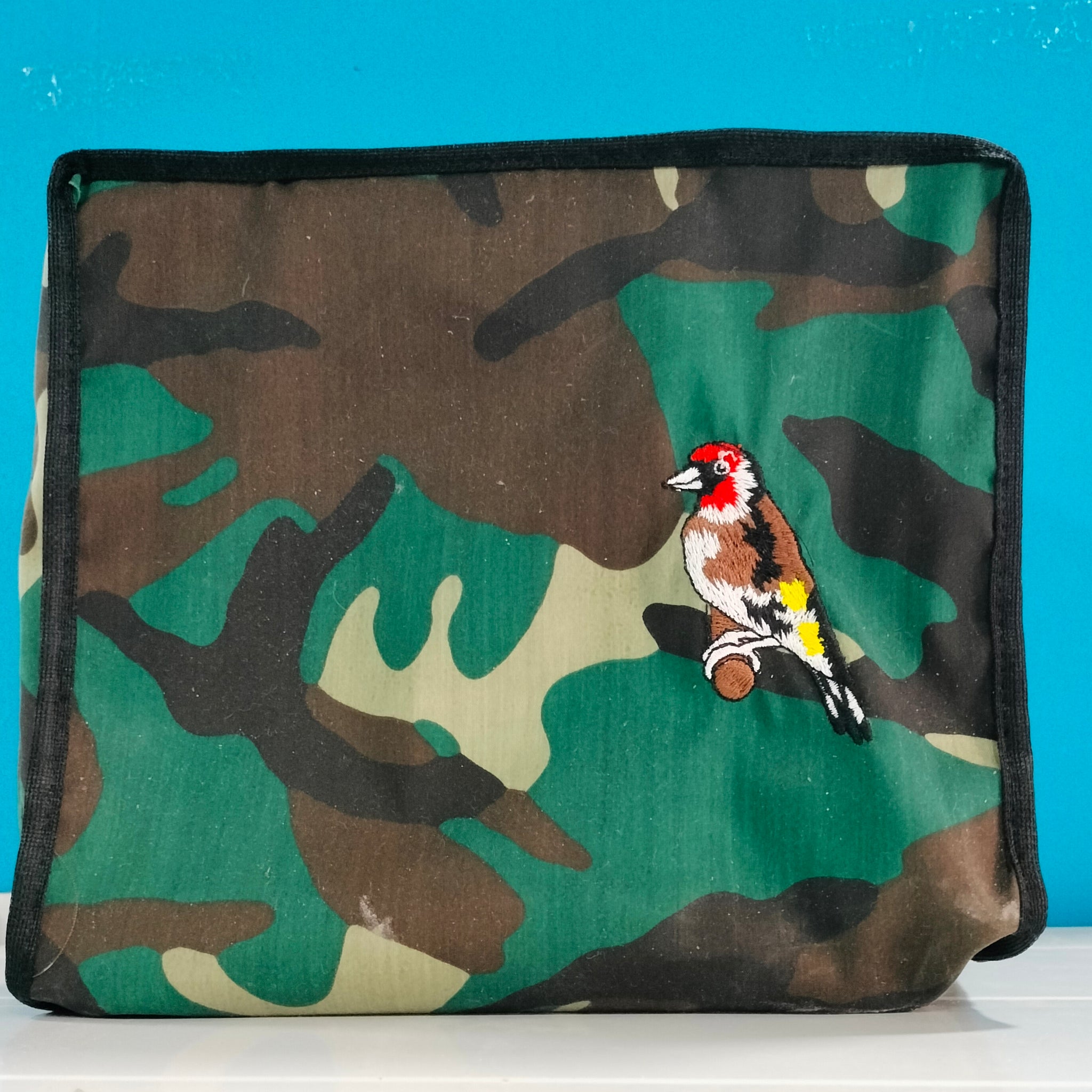 Funda militar con cremallera y bordado Jilguero